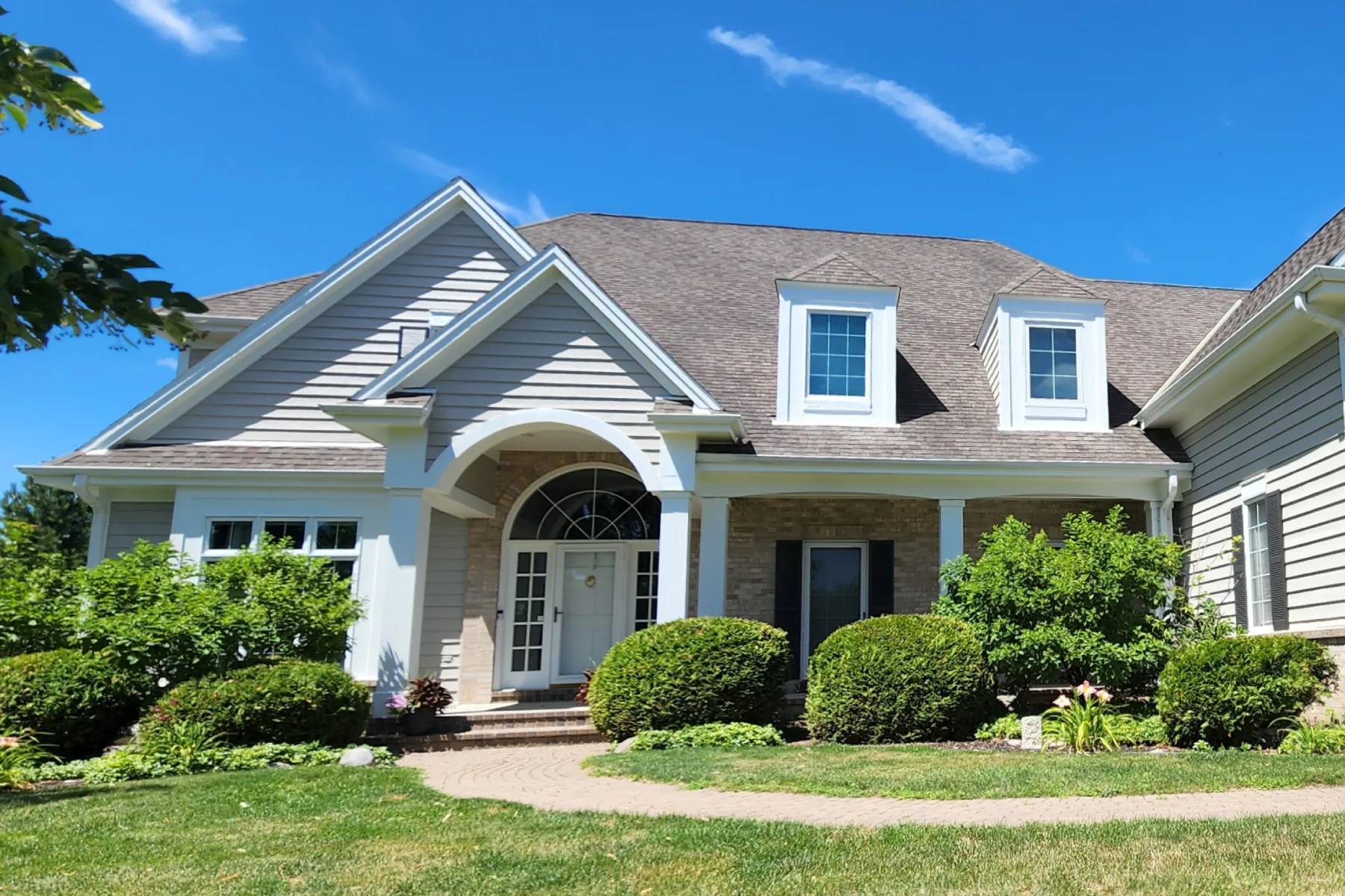A home exterior being painted by a Milwaukee painting contractor